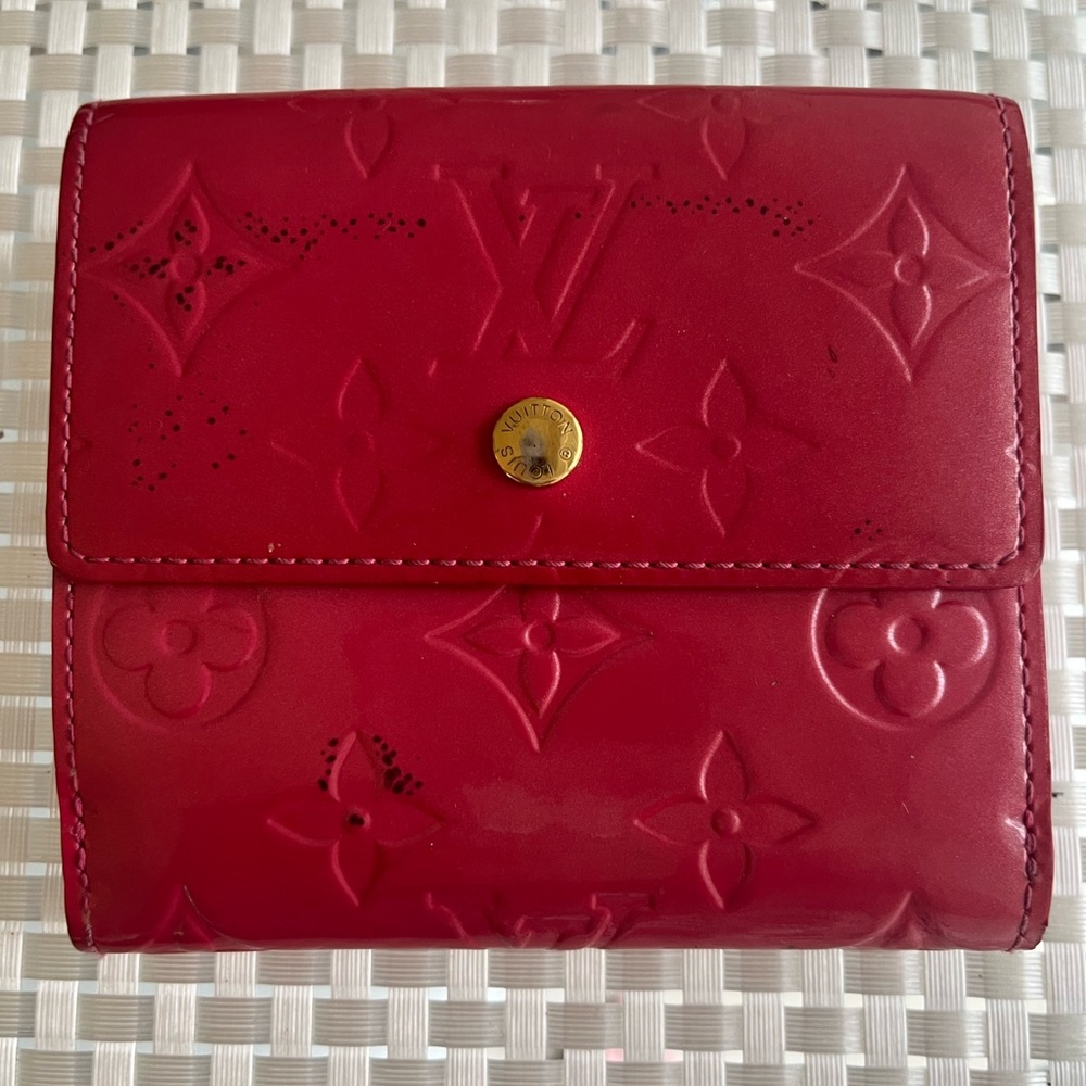 Have fun with this Louis Vuitton, pink patent LV wallet!